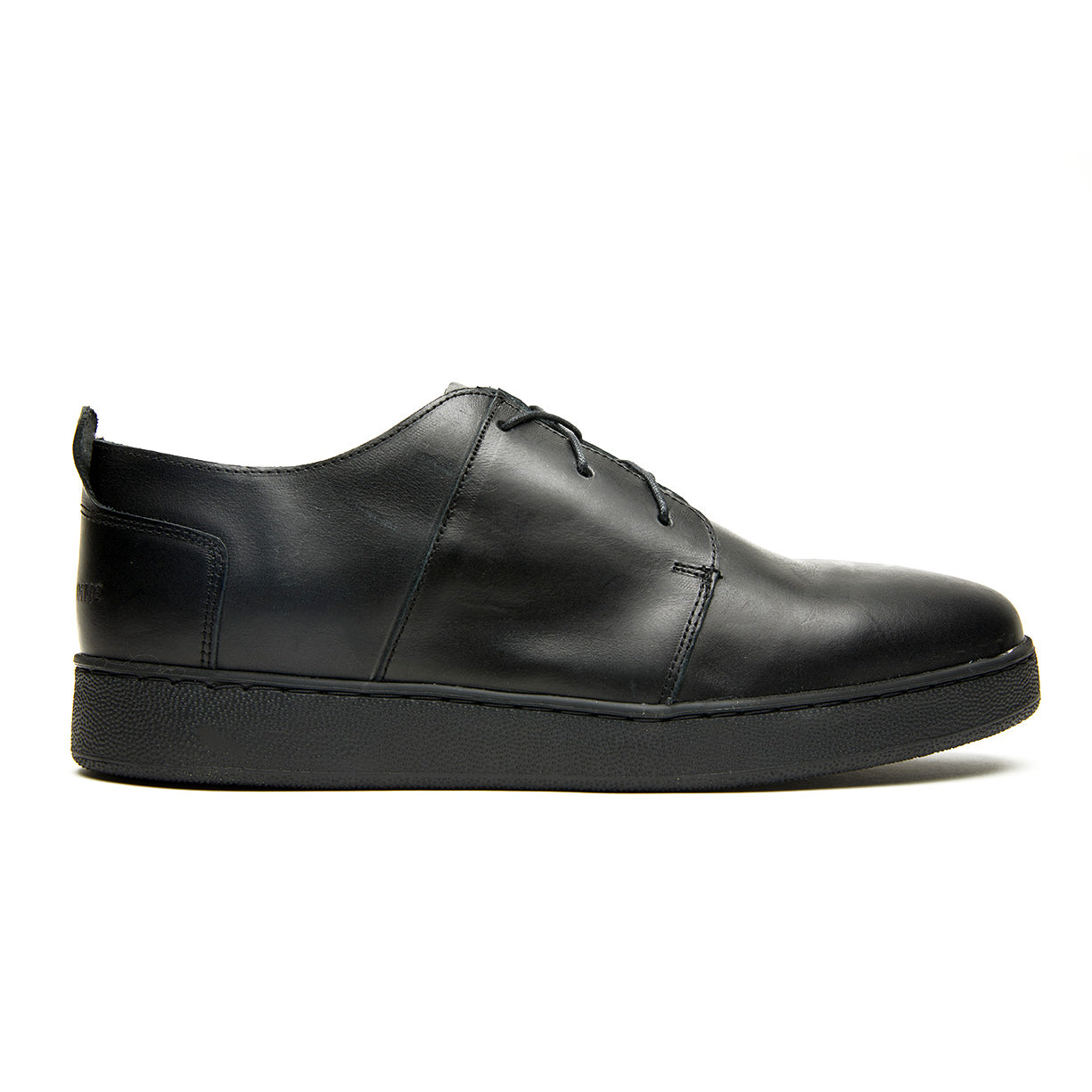 A Ben Low men's sneaker with a black leather upper, lace up closure, and cork filled midsole on a white background by Broken Homme.