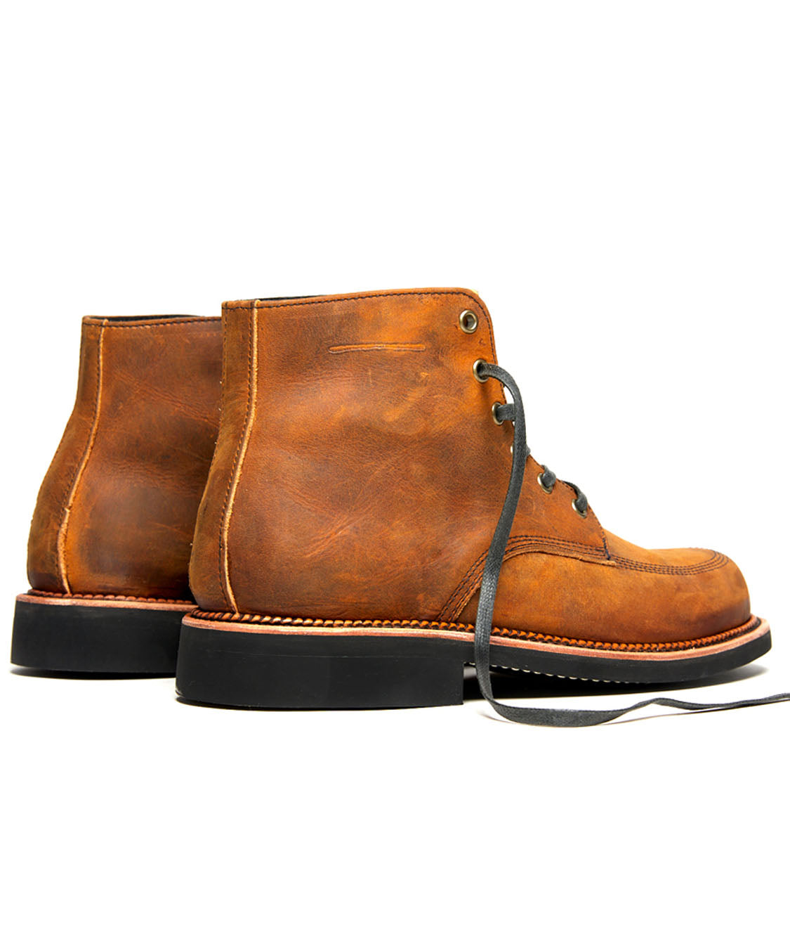 A pair of Davis brown leather boots with black laces from Broken Homme.