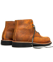 A pair of Davis brown leather boots with black laces from Broken Homme.