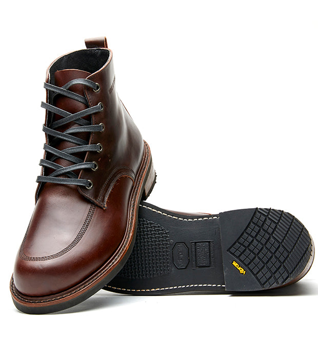 A pair of Broken Homme Davis II men's brown work boots with laces.