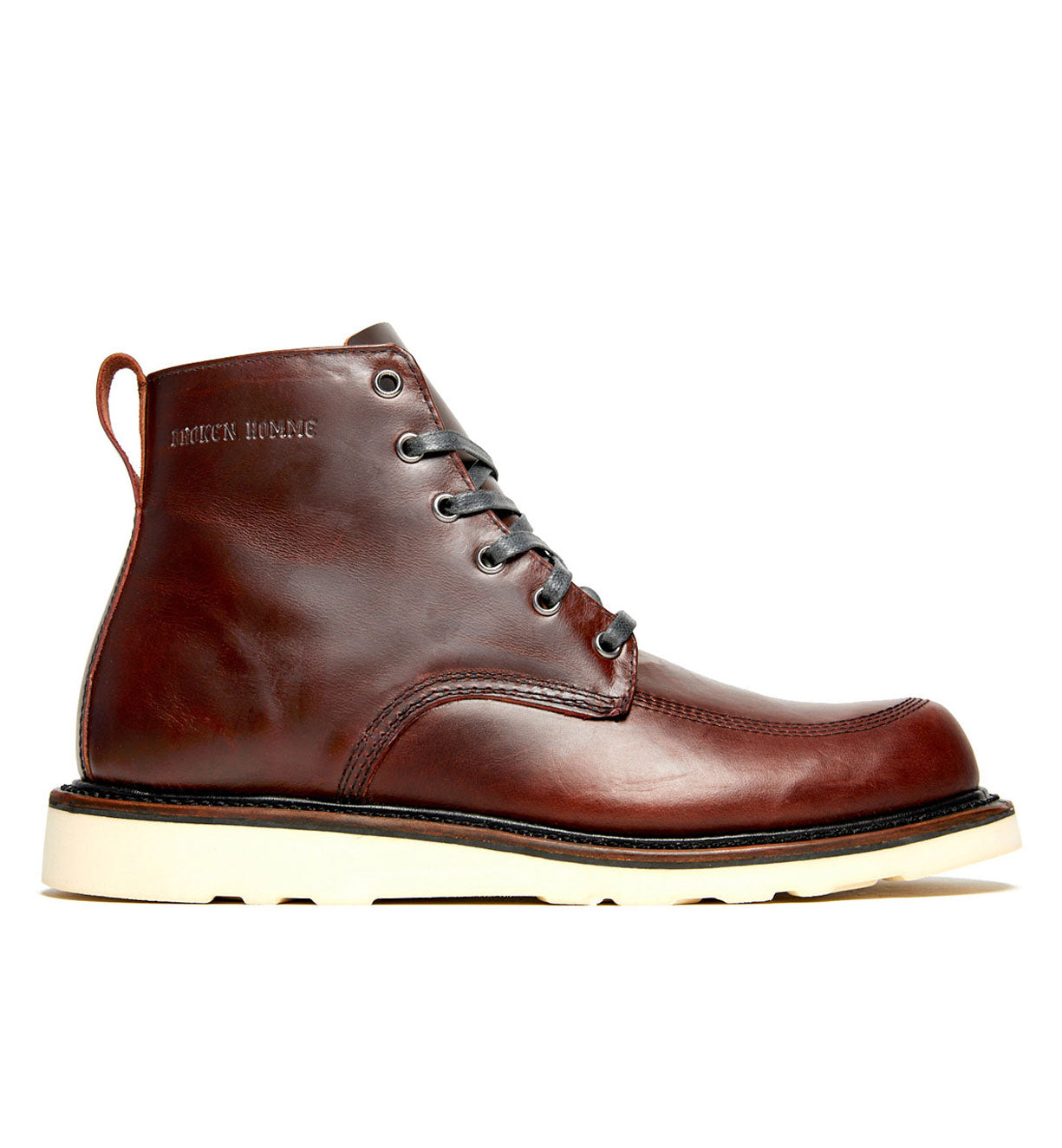 A Jaime Boot by Broken Homme, a leather work boot with a natural wedge sole.