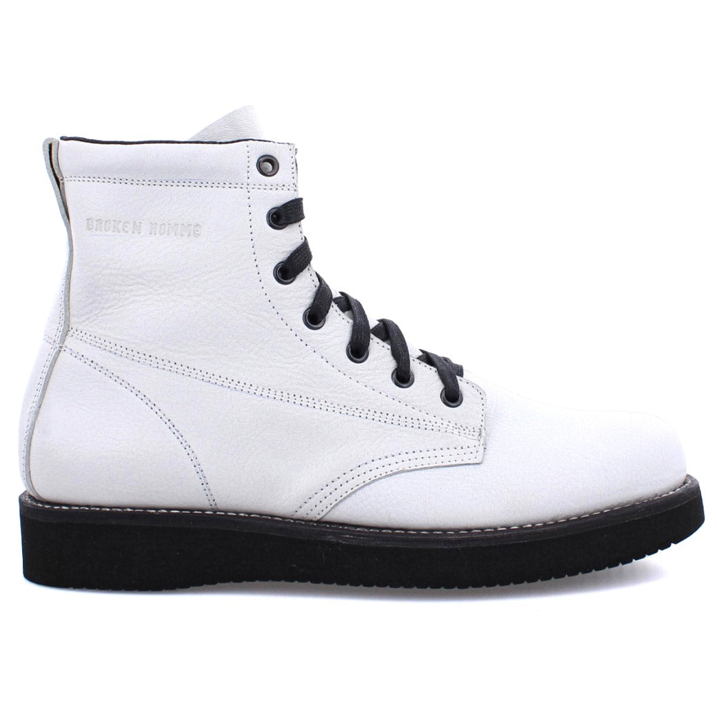 A pair of James boots from the Broken Homme collection, featuring black soles.