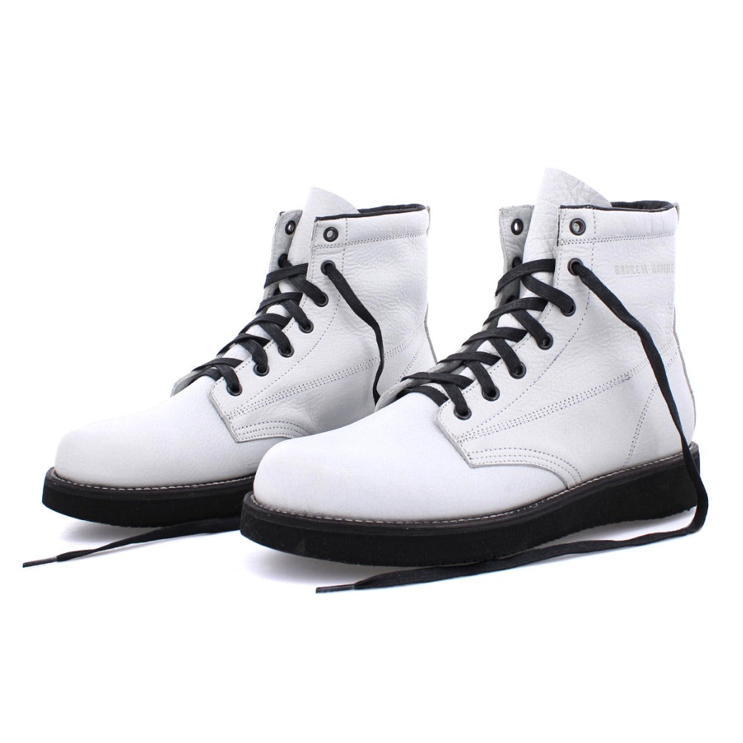 A pair of James Boots from the Broken Homme collection, featuring black laces.