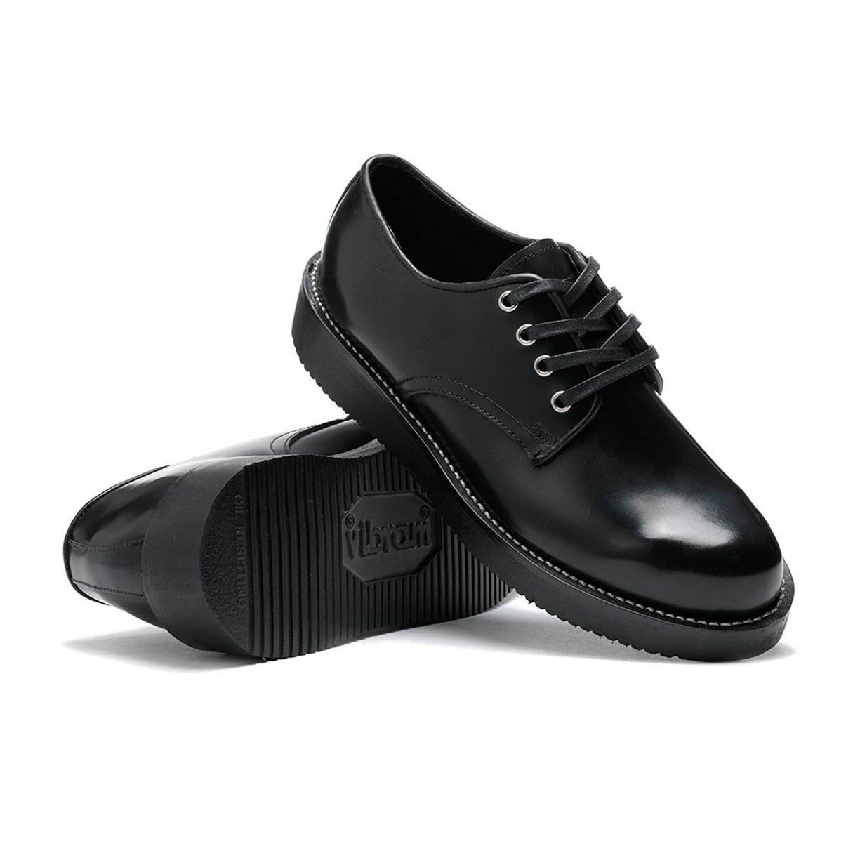 A pair of black leather Michael shoes with an oxford silhouette on a white background by Broken Homme.