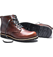 A pair of Tydus boots by Broken Homme with a refined style on a white background.