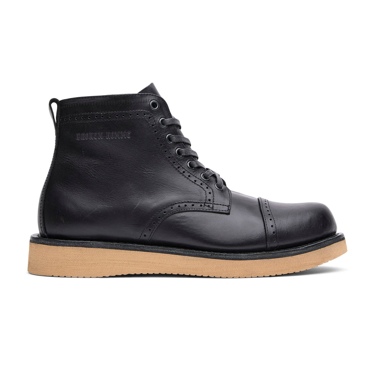 The Broken Homme Shaun boot features a goodyear welt construction, combining durability and style with its black leather upper and gum sole.