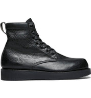 A black leather James Boot with a rubber sole from the Broken Homme collection.