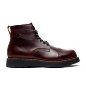 The Aaron men's burgundy leather boot from the Broken Homme collection is shown on a white background, featuring a cap toe silhouette.