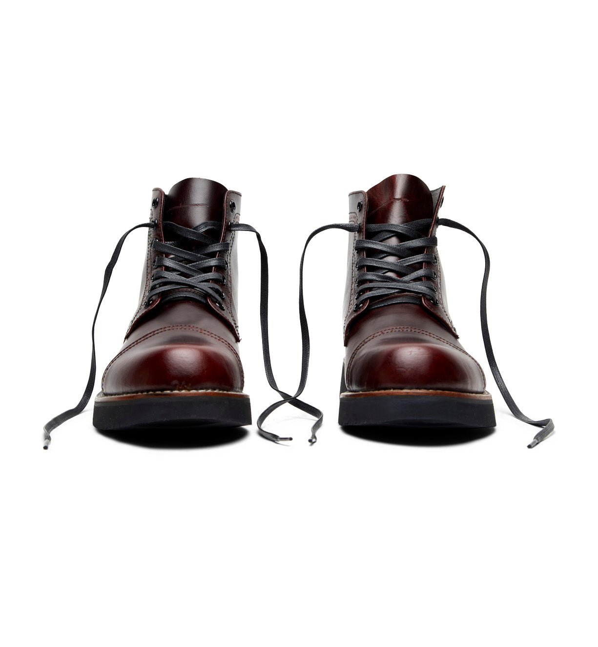 A pair of classic Aaron burgundy leather boots by Broken Homme on a white background.