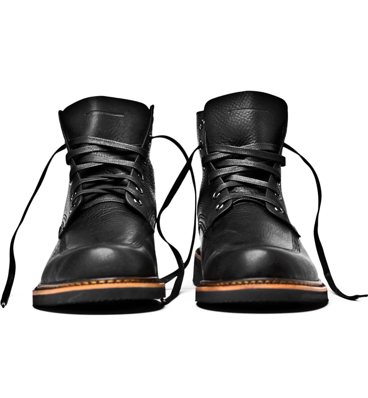 A pair of comfortable black leather Davis boots on a white background, from the Broken Homme brand.