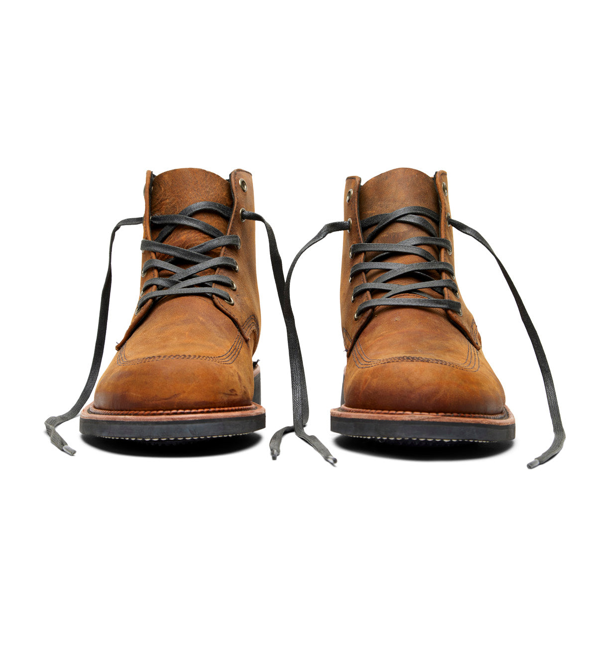 A pair of Davis boots by Broken Homme, made of brown leather with laces on a white background.