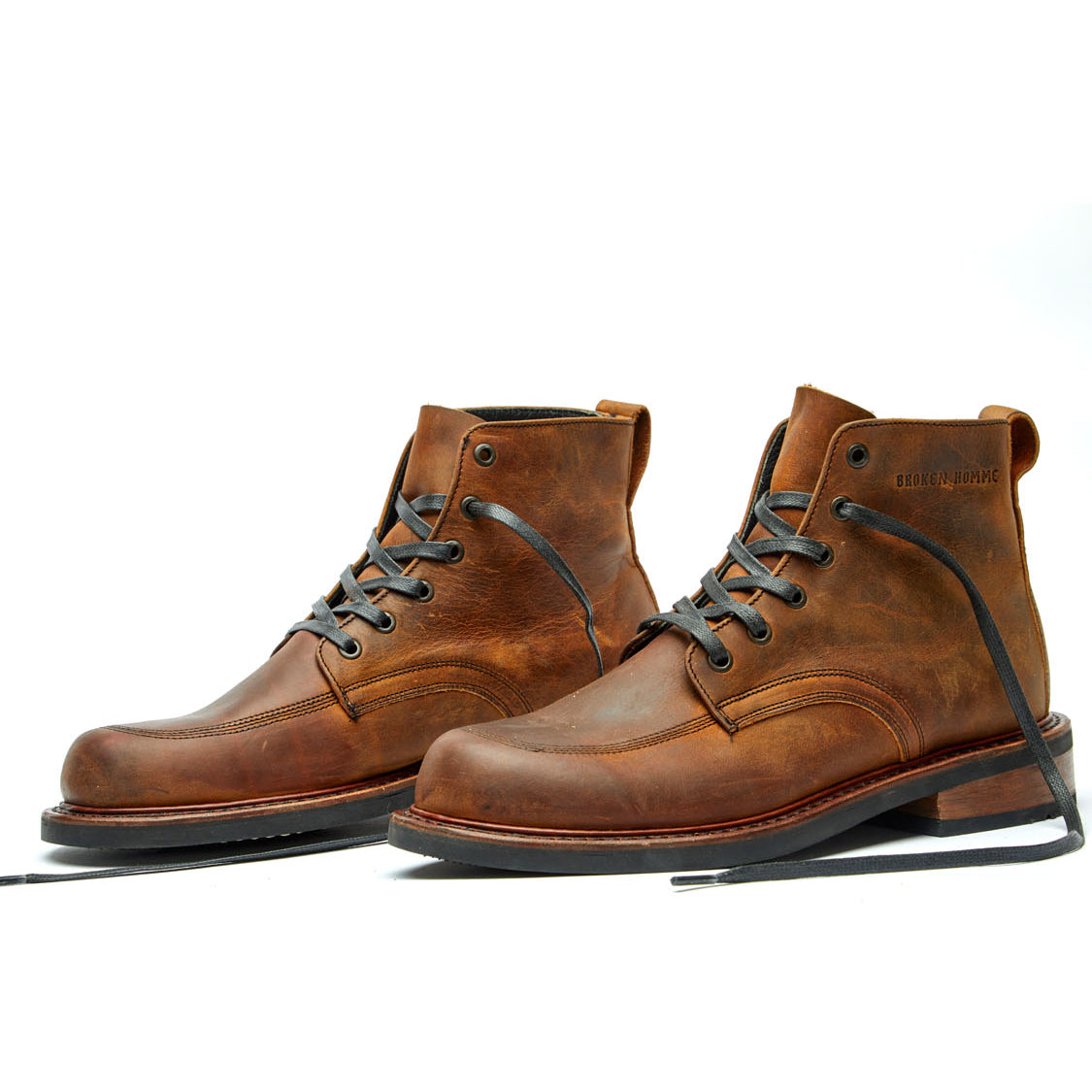 A pair of Davis II brown leather work boots by Broken Homme on a white background.