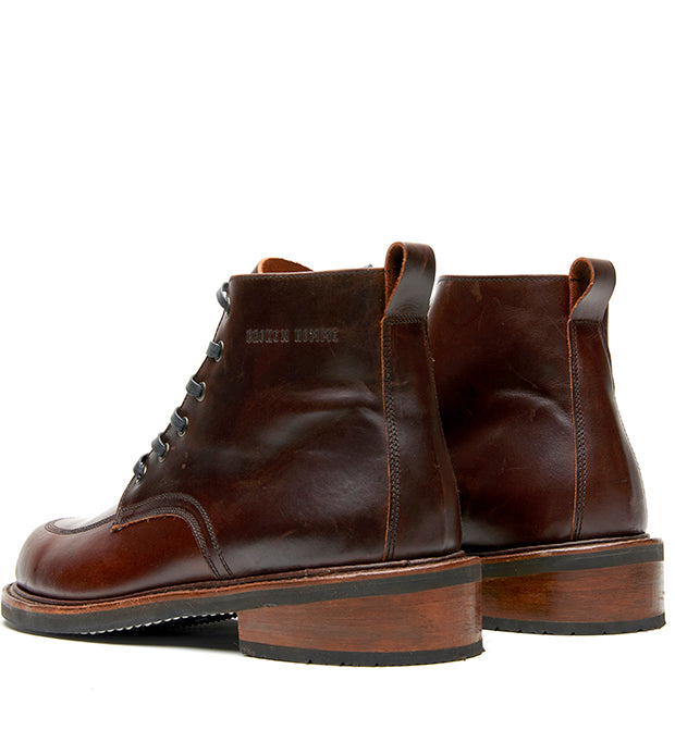 A pair of Davis II brown leather work boots by Broken Homme on a white background.