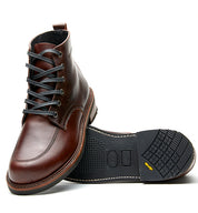 A pair of Broken Homme Davis II men's brown work boots with laces.