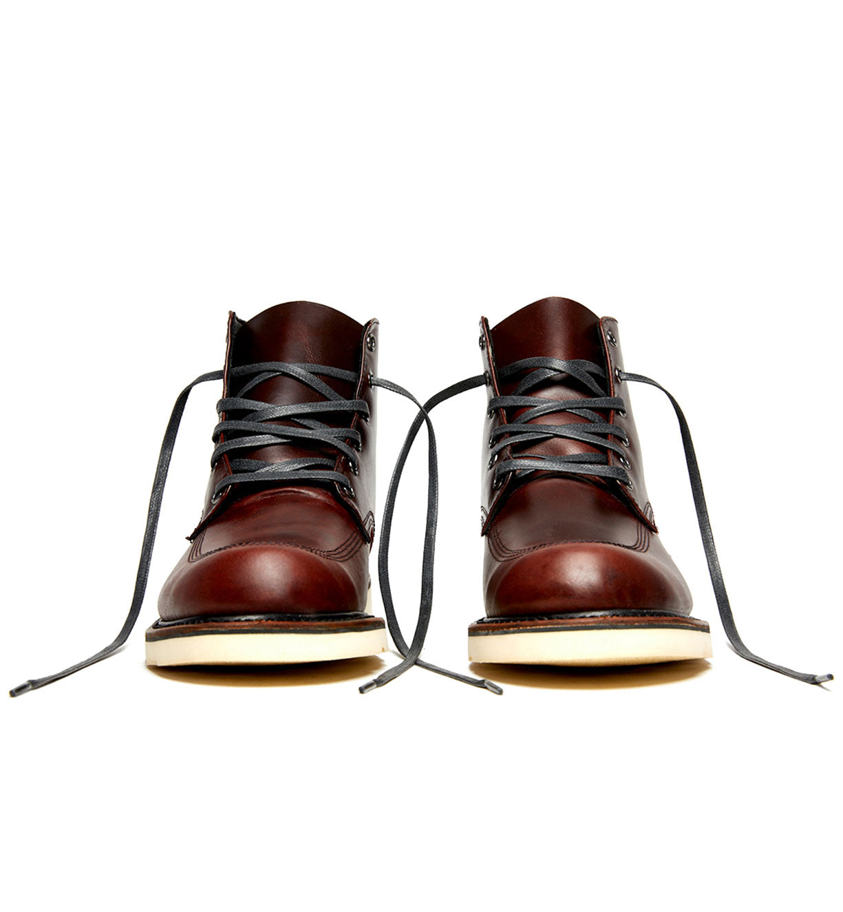 A pair of Broken Homme Jaime Boots with laces, showcased on a white background.
