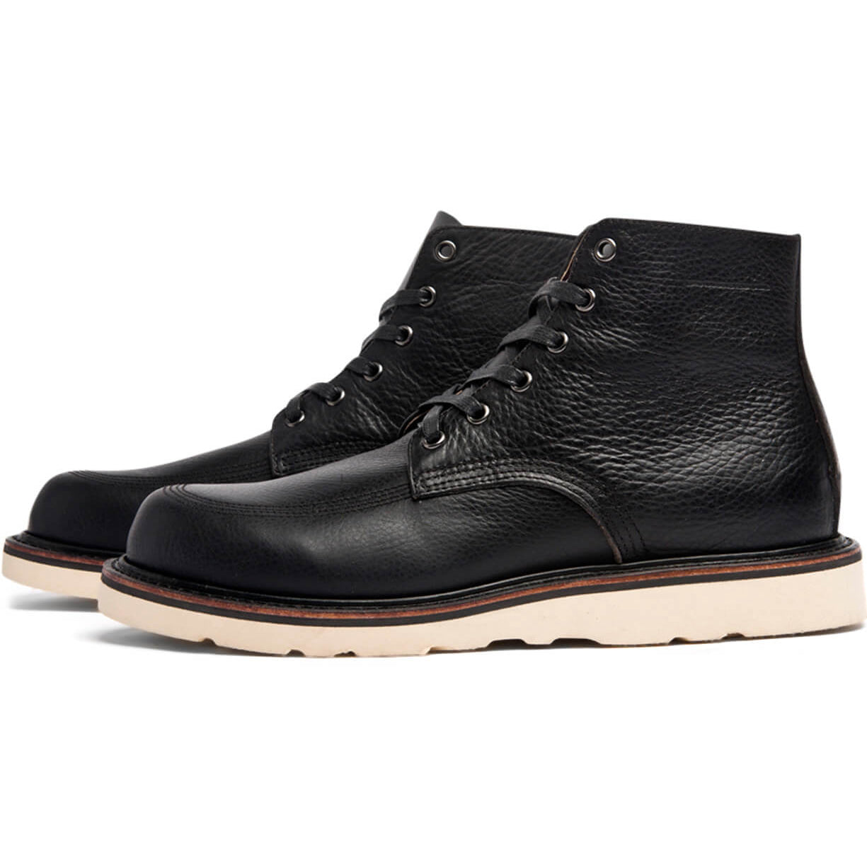 A black leather Jaime Boot by Broken Homme with a white sole.