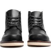 A pair of comfortable fit Broken Homme Jaime Boots on a white background.