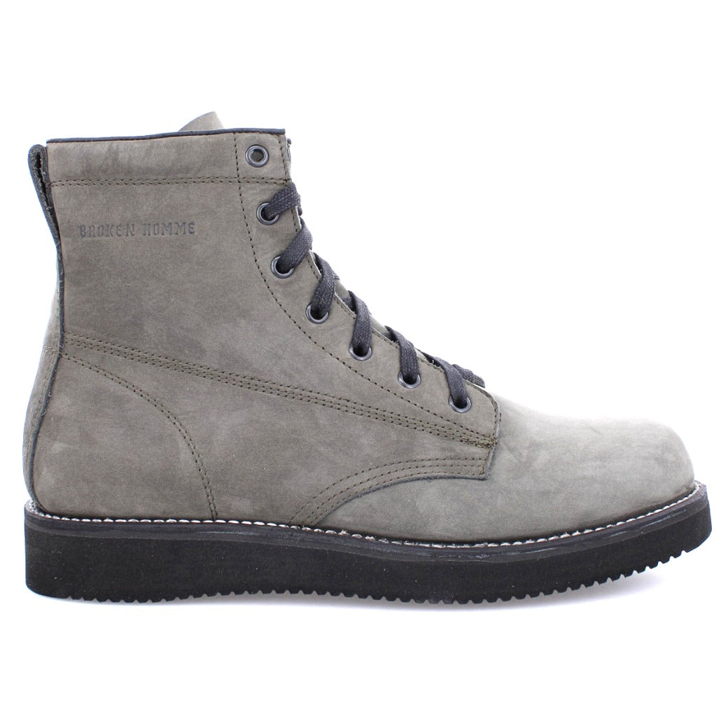 A grey men's James Boot from the Broken Homme collection with black soles.