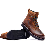 A pair of brown leather James boots by Broken Homme on a white background.