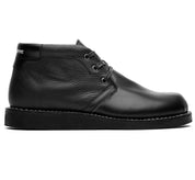 A Jayson boot by Broken Homme, a black leather chukka boot featuring a non-slip outsole on a white background.