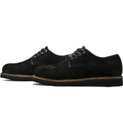 A pair of Broken Homme Michael II black suede shoes with pinpoint construction details on a white background.