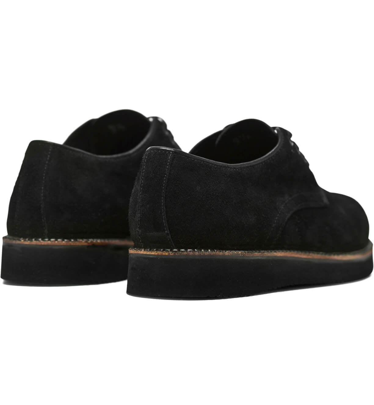 A pair of Michael II black suede shoes with pinpoint construction details on a white background, made by Broken Homme.