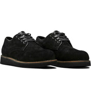 A pair of Broken Homme Michael II black suede shoes featuring pinpoint construction details and an oxford silhouette, showcased against a pristine white background.