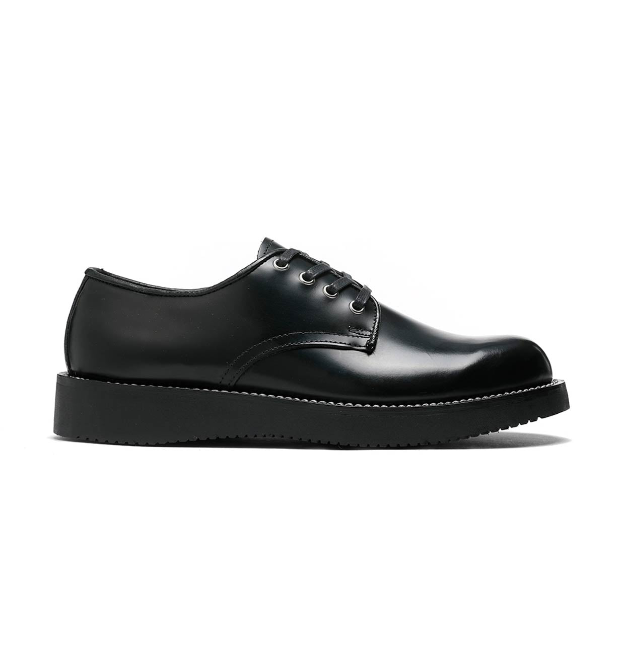 A pair of black Michael derby shoes with leather uppers and a vibram wedge outsole on a white background by Broken Homme.