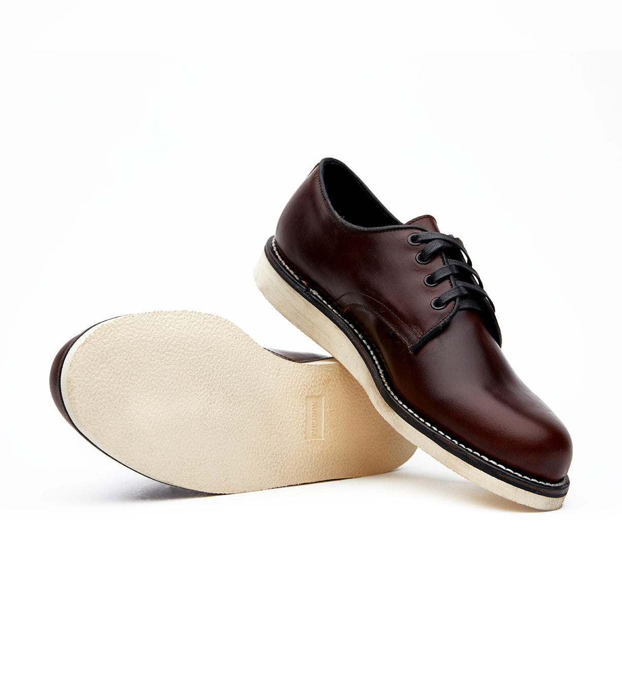 A comfortable pair of Broken Homme Michael II brown derby shoes with an oxford silhouette and Vibram wedge outsole on a white background.