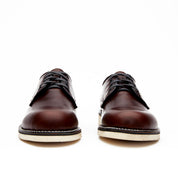 A pair of brown Broken Homme Michael II shoes on a white background, featuring Vibram wedge outsole for added comfort.