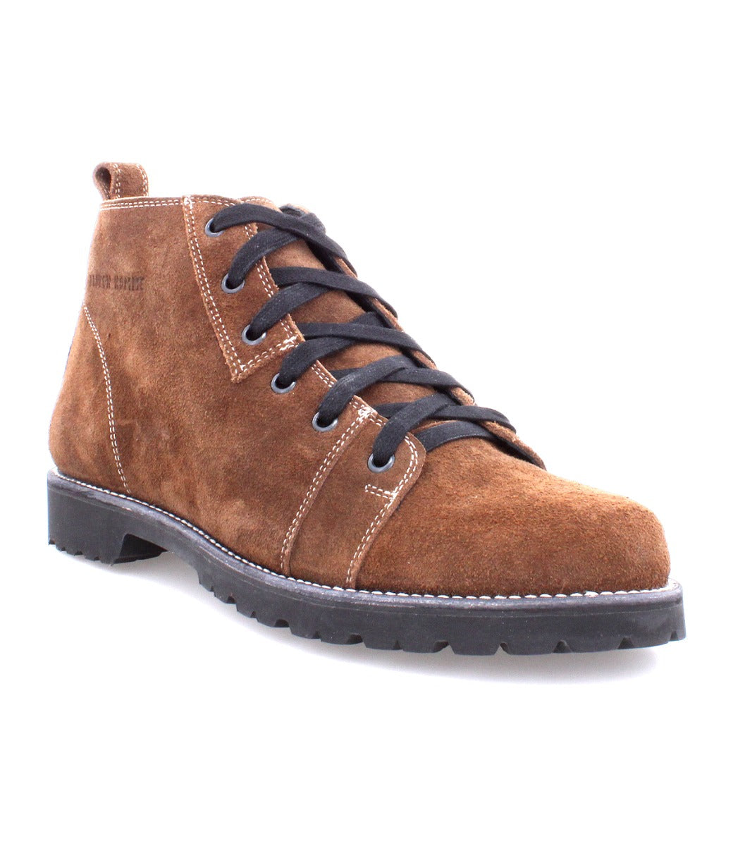 A brown suede Parker Boot with black laces, featuring a Vibram Lug hiking outsole, made by Broken Homme.