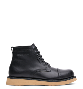 The Broken Homme Shaun boot features a sleek black leather upper paired with a durable gum sole.
