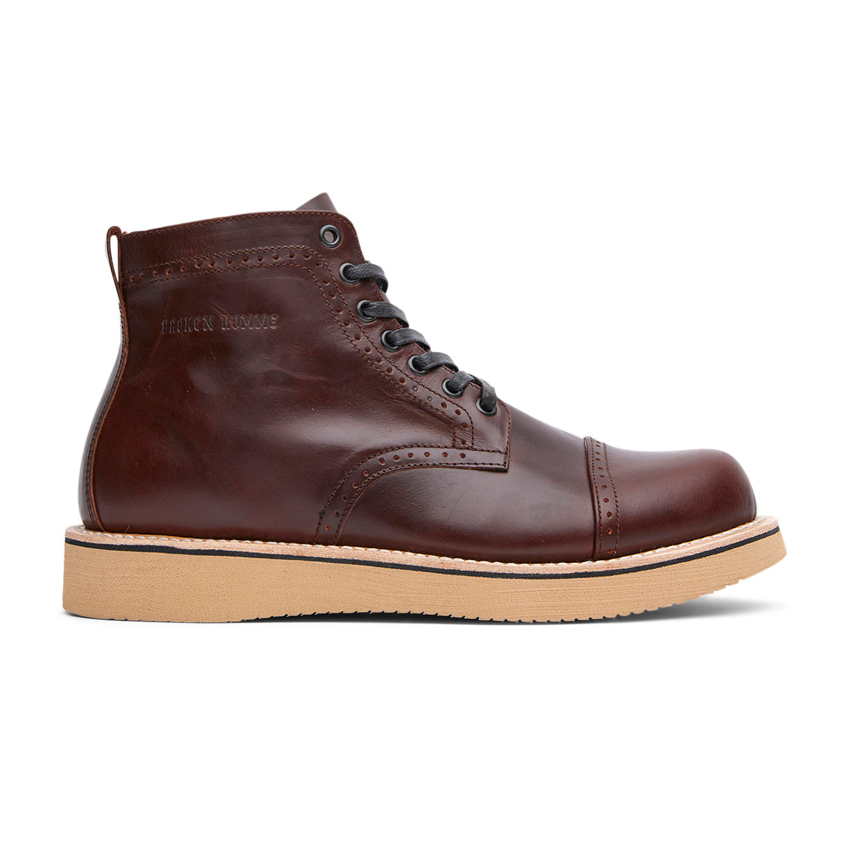 The Broken Homme Shaun boot is a stylish men's brown leather boot with a rubber sole.