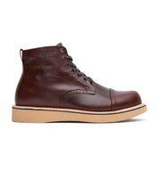 The Broken Homme Shaun boot is a stylish men's brown leather boot with a rubber sole.