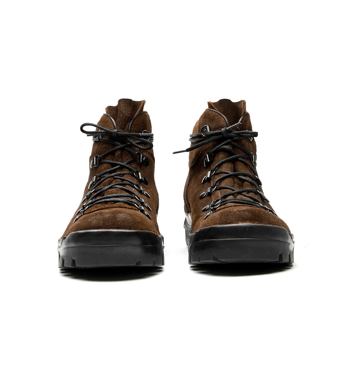 A pair of brown Broken Homme Weber hiking boots with a crossover boot design on a white background.