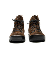 A pair of brown Broken Homme Weber hiking boots with a crossover boot design on a white background.