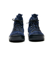 A pair of blue suede Broken Homme Weber boots with black laces.